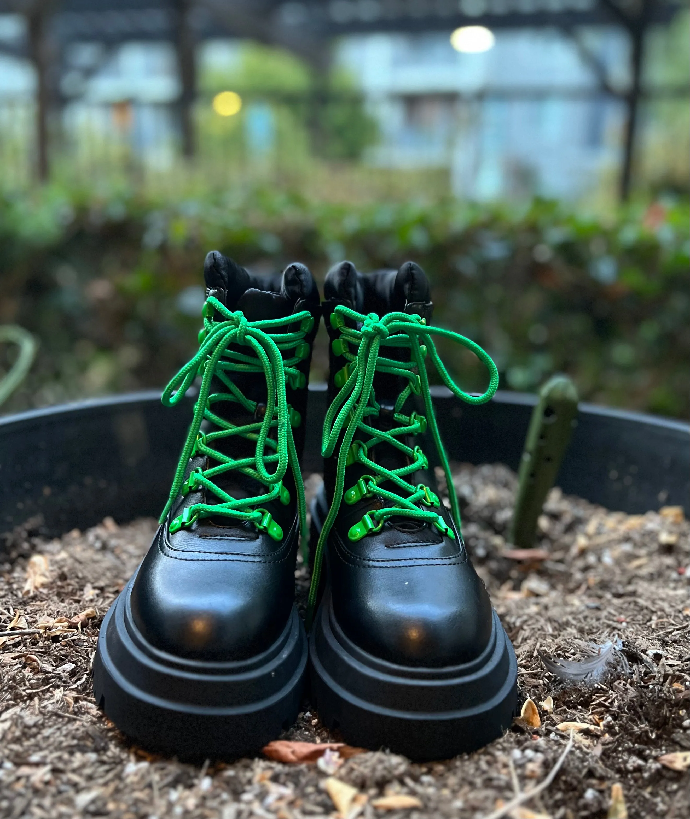 Cute leather lady’s combat boots with green laces!