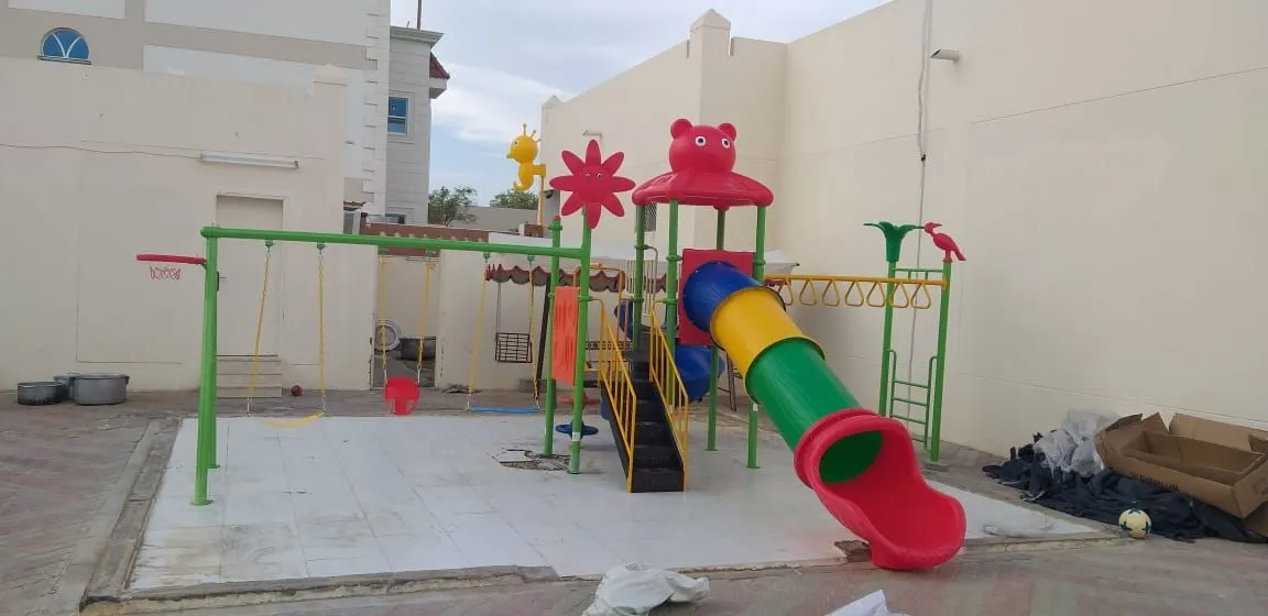 Two slides, three swings and monkey bar playground